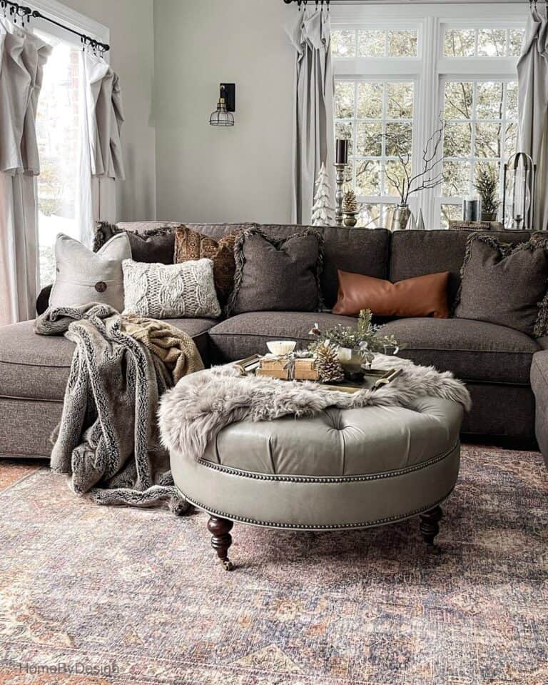 Earth-Toned Living Room with Round Tufted Pouf