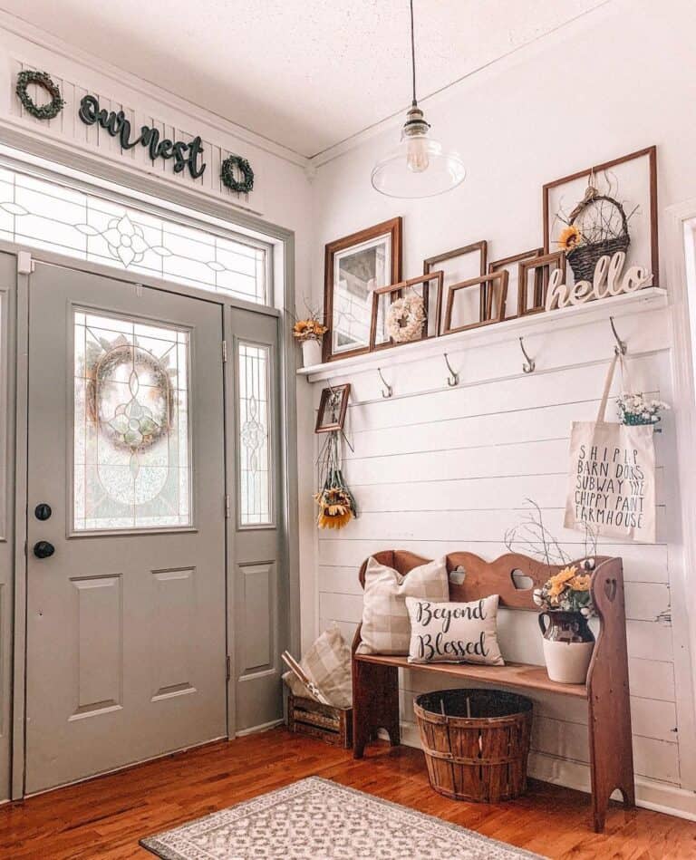 Entryway Bench With a Brown Basket Beneath It