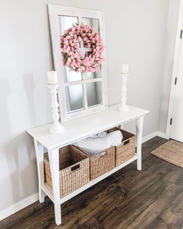 Entryway with White Side Table and Pink Floral Wreath