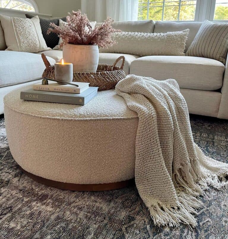 Fabric Ottoman with Draped Blanket