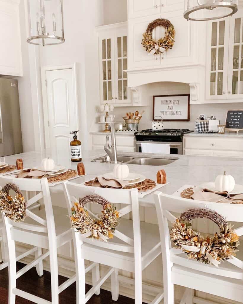 Fall Wreaths Attached to Tall White Dining Room Chairs