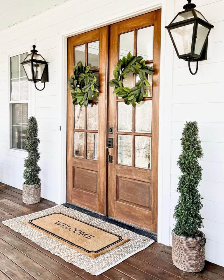 Front Door with Two Tall Spiral Bushes