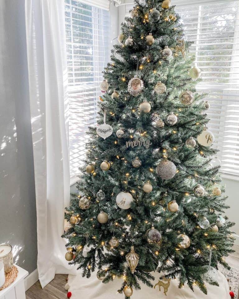 Gold Christmas Ornaments Hang from a Green Tree