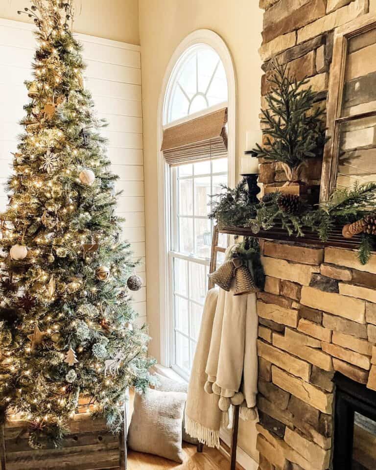Gold Christmas Tree Decorations Near a Stone Fireplace