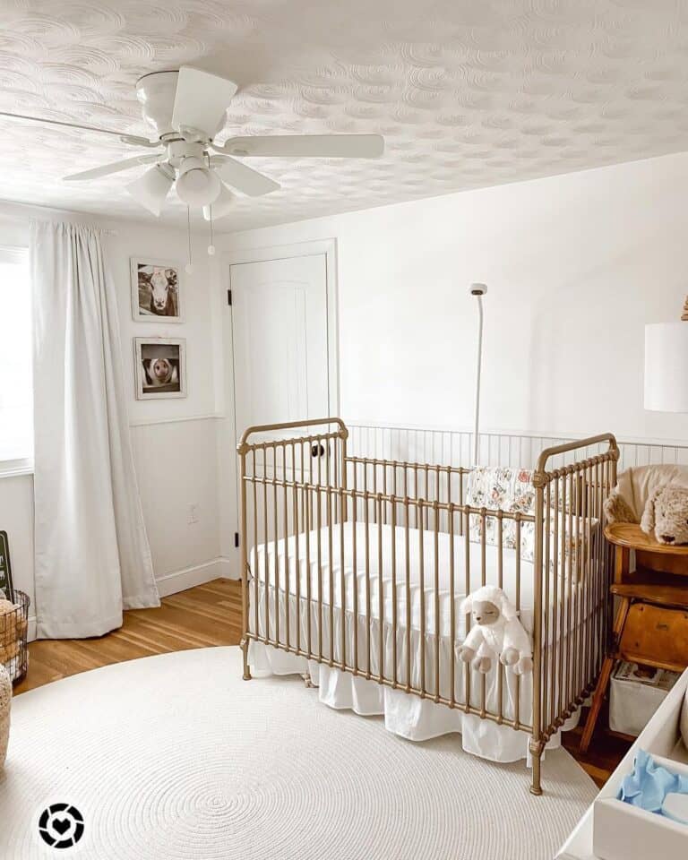 Gold Crib in a White Baby Girl Nursery