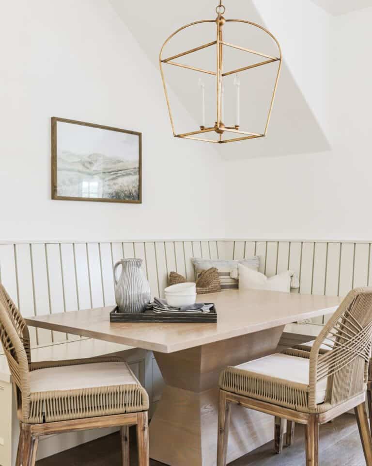 Gold Lantern Light Fixture Over a Wooden Tray