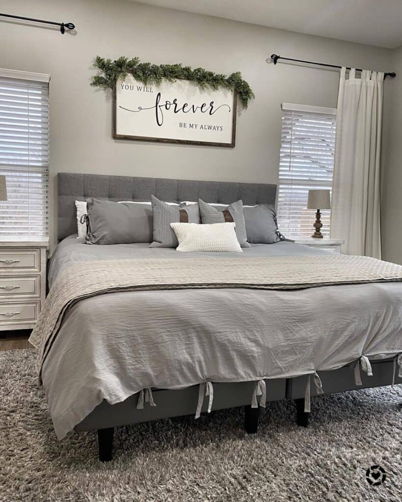 Gray Tufted Headboard Between Two Windows