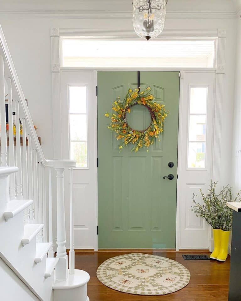 Green Door Entryway with Wood Flooring