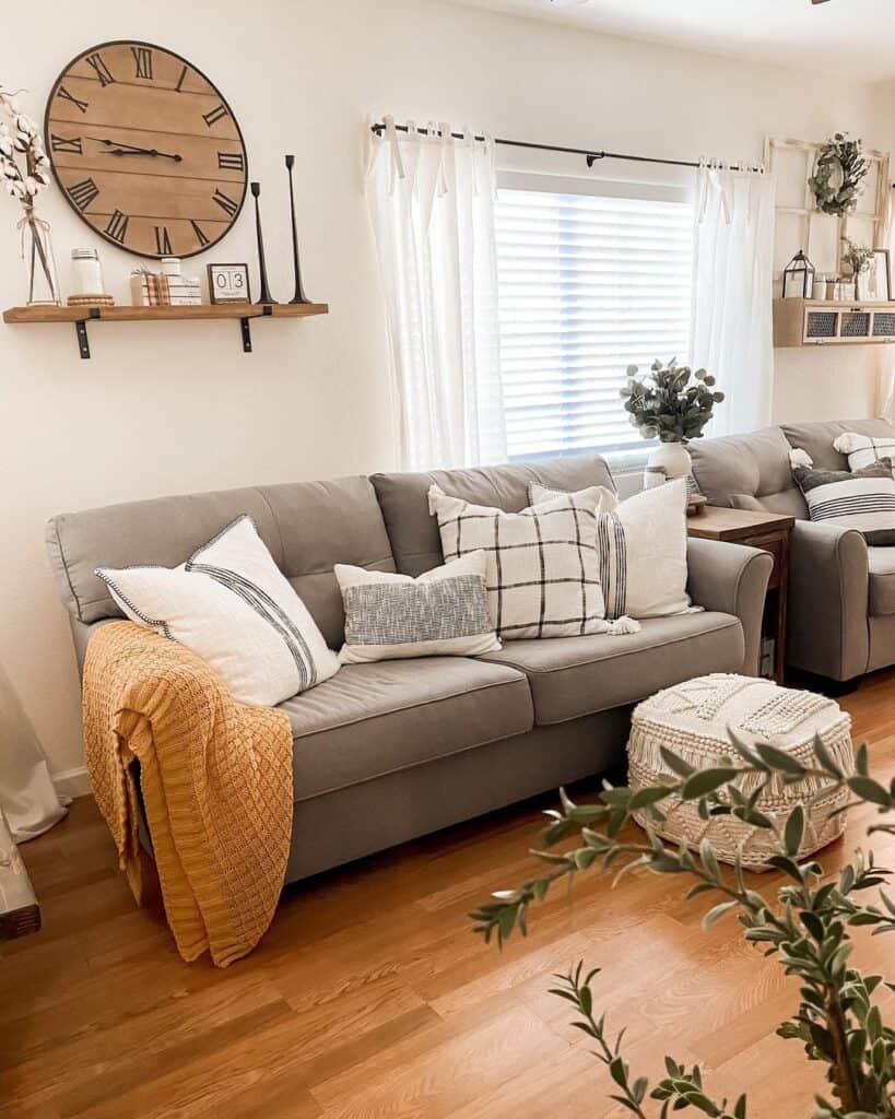 Grey Loveseats with White and Grey Throw Pillows