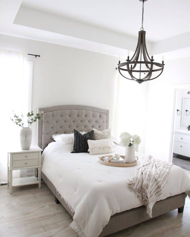 Grey Tufted Headboard and a Plain White Wall