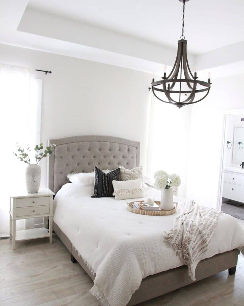 Grey Tufted Headboard and a Plain White Wall