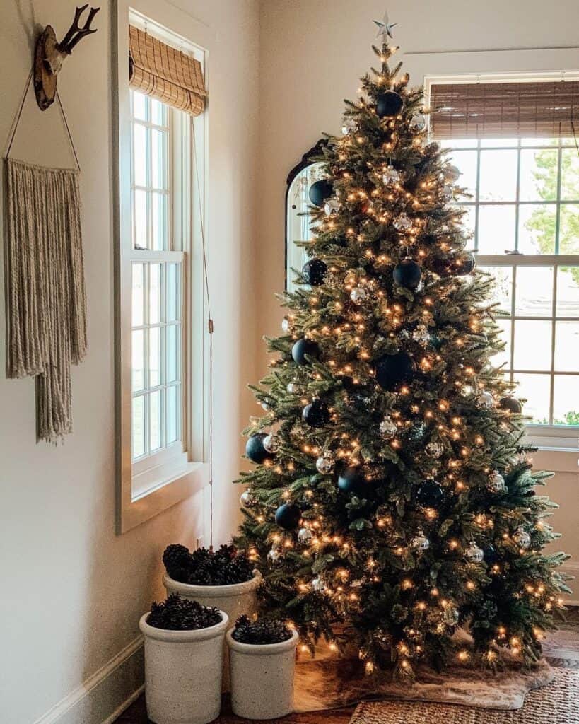 Illuminated Christmas Tree with Black and Silver Ornaments