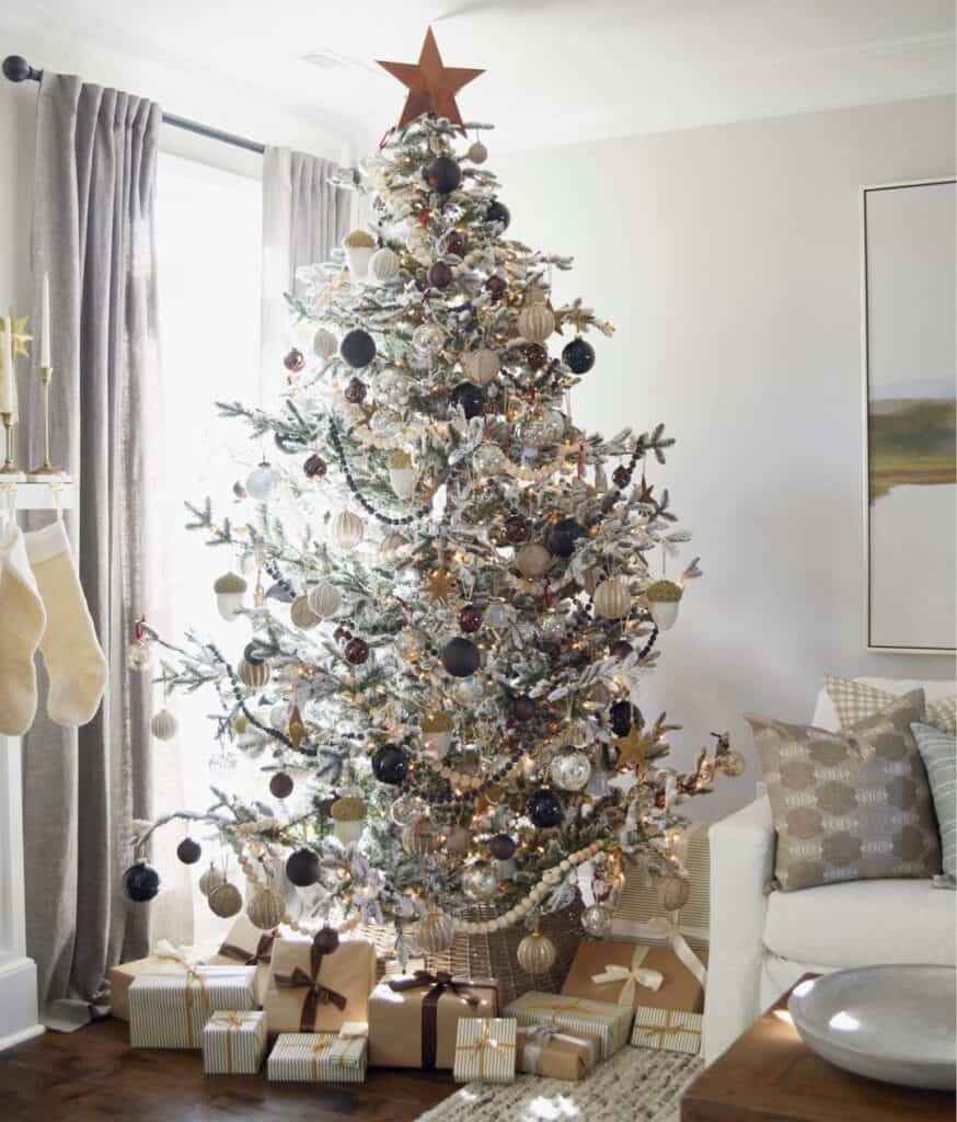 Large Flocked Tree with White and Black Garland and Matching Ornaments