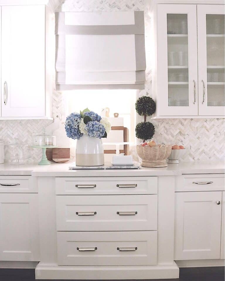 Light Blue Kitchen Decor and a Herringbone Tile Backsplash