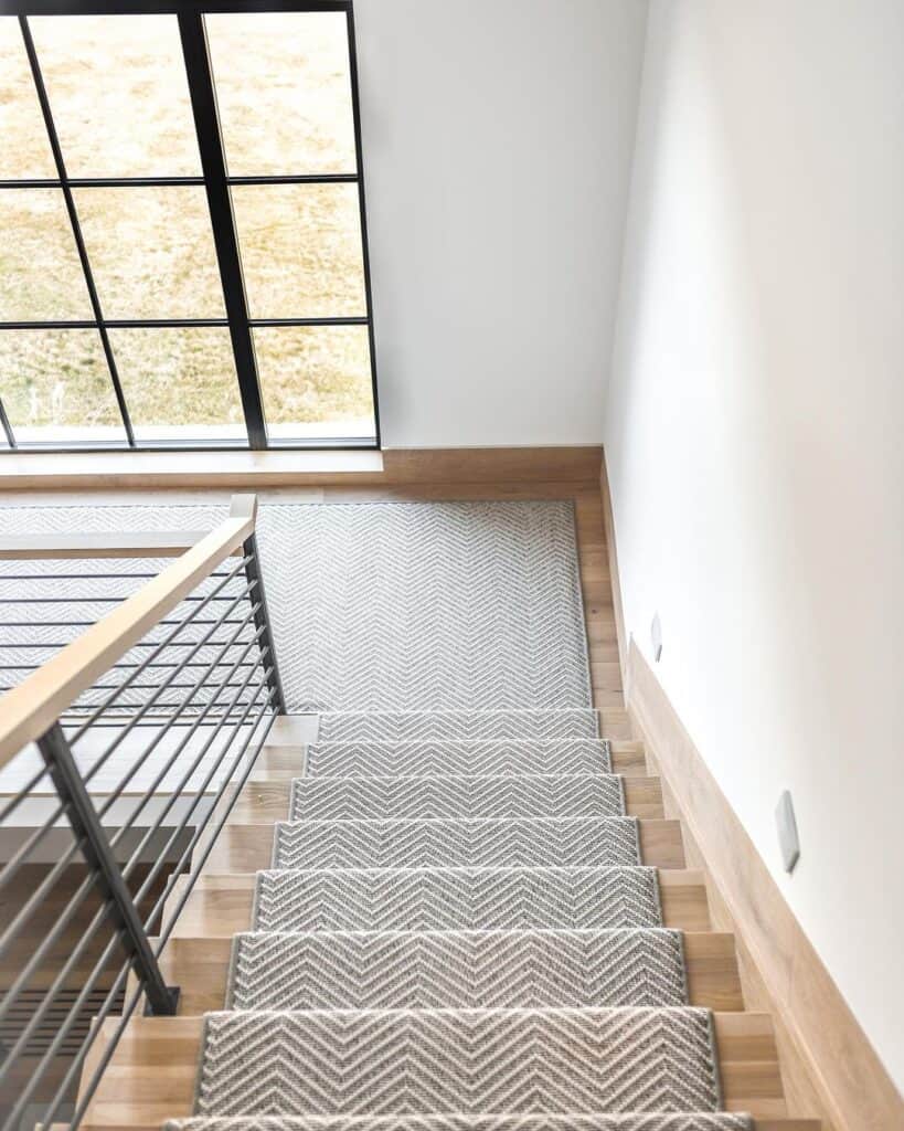 Light Wood Staircase Trim with Geometric Runner