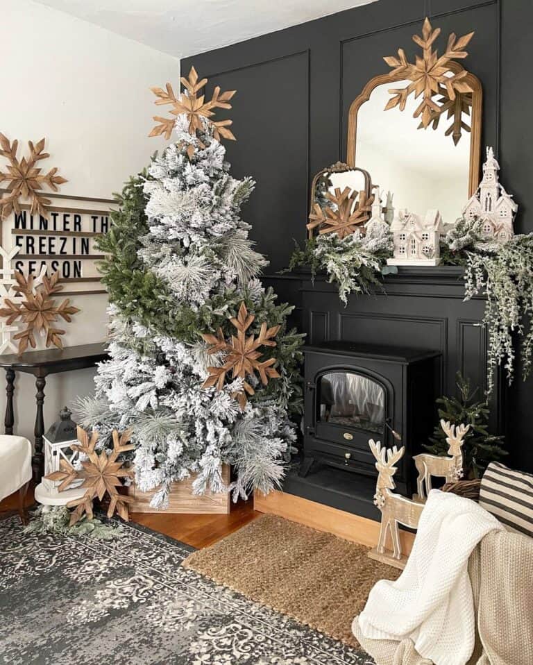 Fireplace with White Wood Snowflake Decorations - Soul & Lane