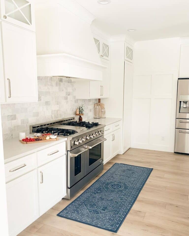 Long Royal Blue Rug and White Kitchen Cabinets
