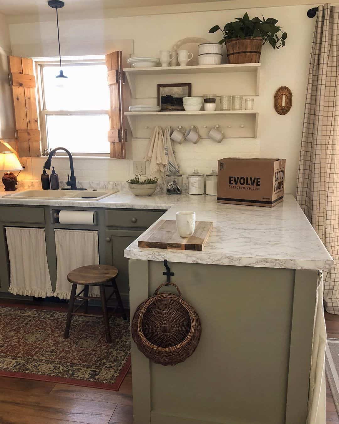 https://www.soulandlane.com/wp-content/uploads/2022/10/Marbled-Countertop-on-Rustic-Sage-Green-Kitchen-Cabinets.jpg