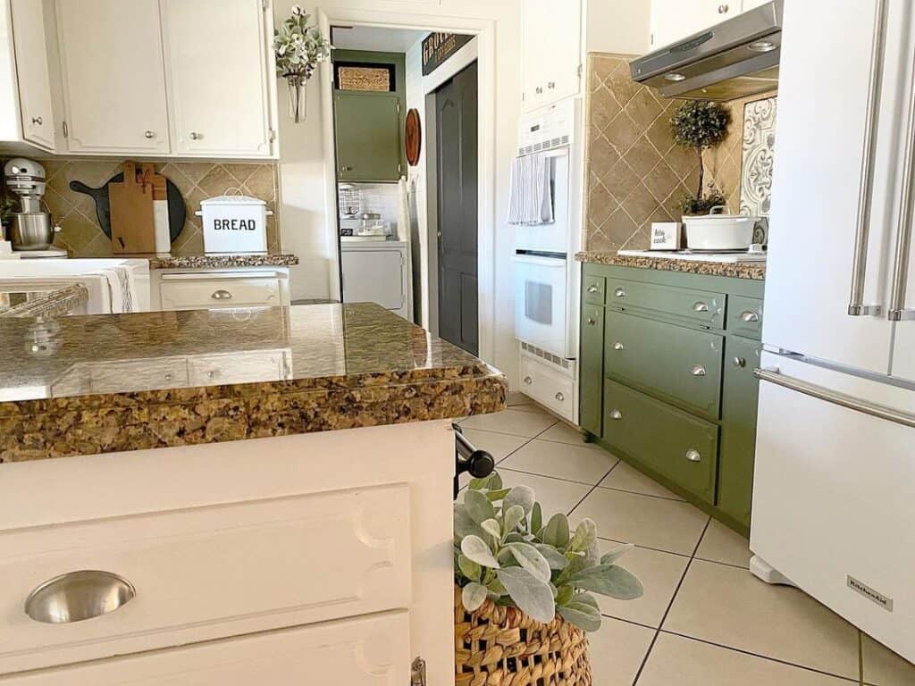 Modern Sage Green Kitchen Cabinets and a Brown Backsplash