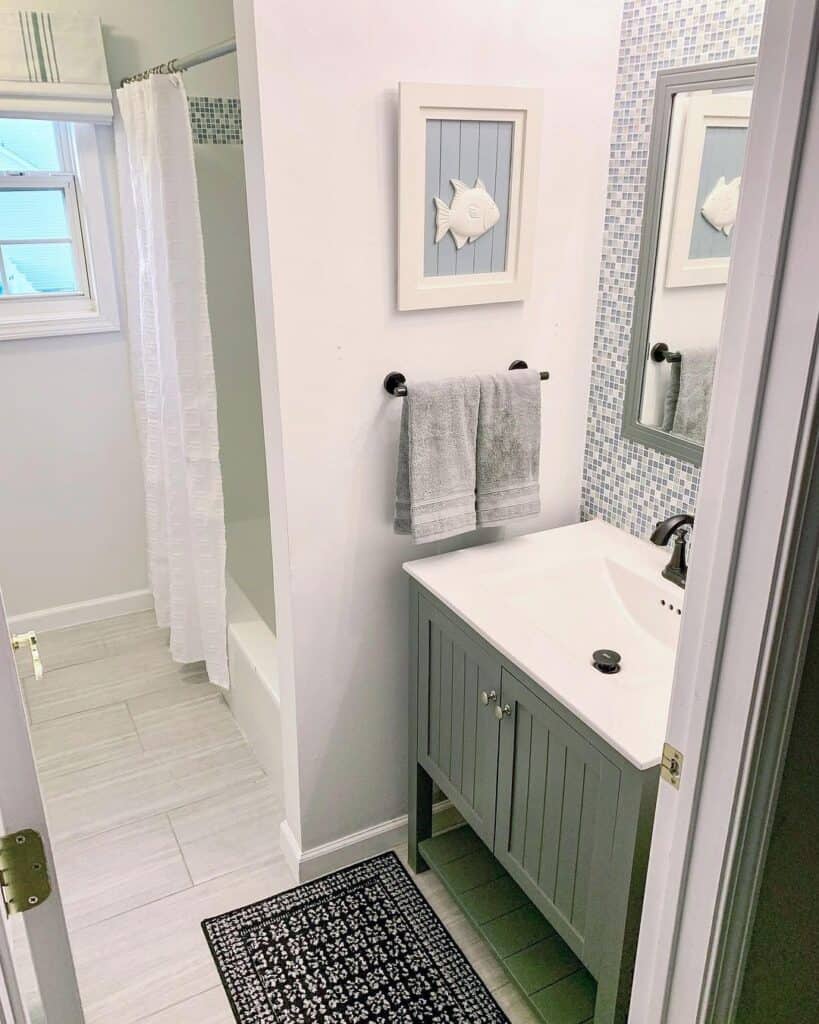 Mosaic Wall Behind Green Bathroom Vanity