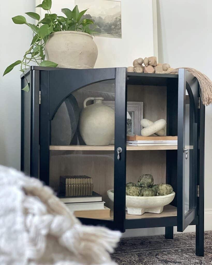 Neutral Décor Accessorizes Black and Glass Cabinet