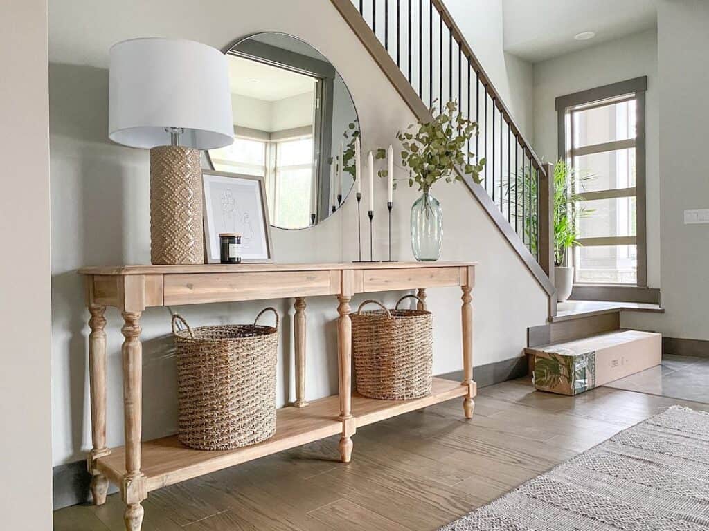 Neutral Entryway with Circular Stair Wall Mirror