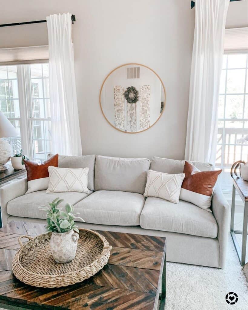 Neutral Living Room With Two Brown Leather Throw Pillows