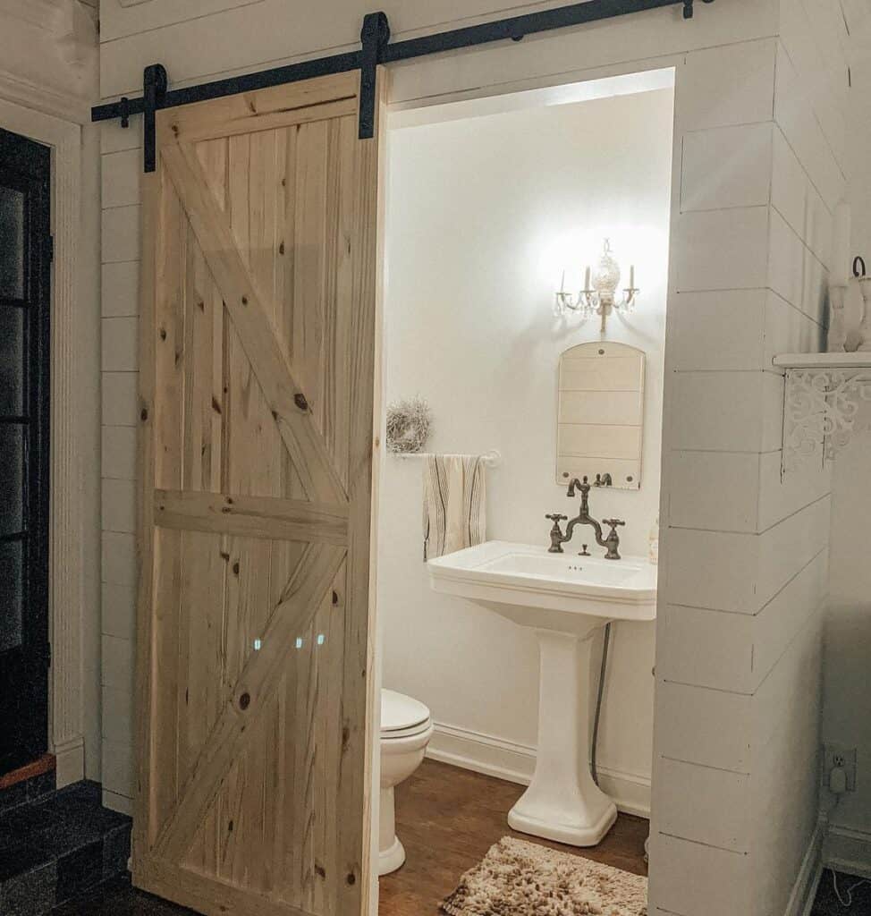 Pedestal Sink Bathroom with Natural Barn Door