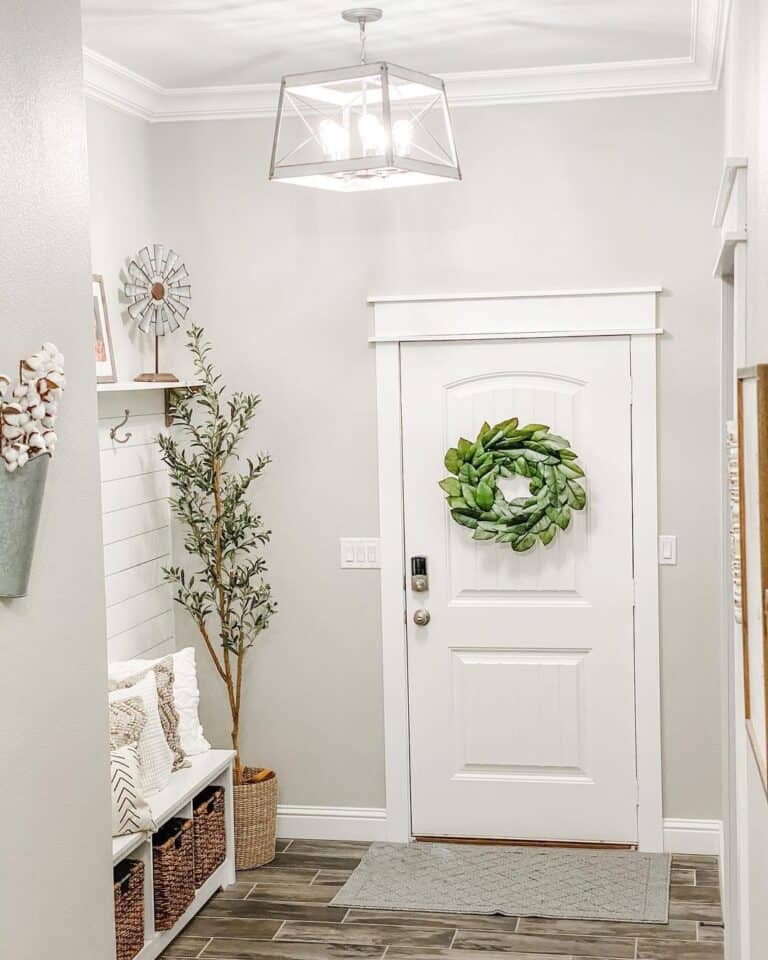 Pillows on a White Entryway Bench With Storage