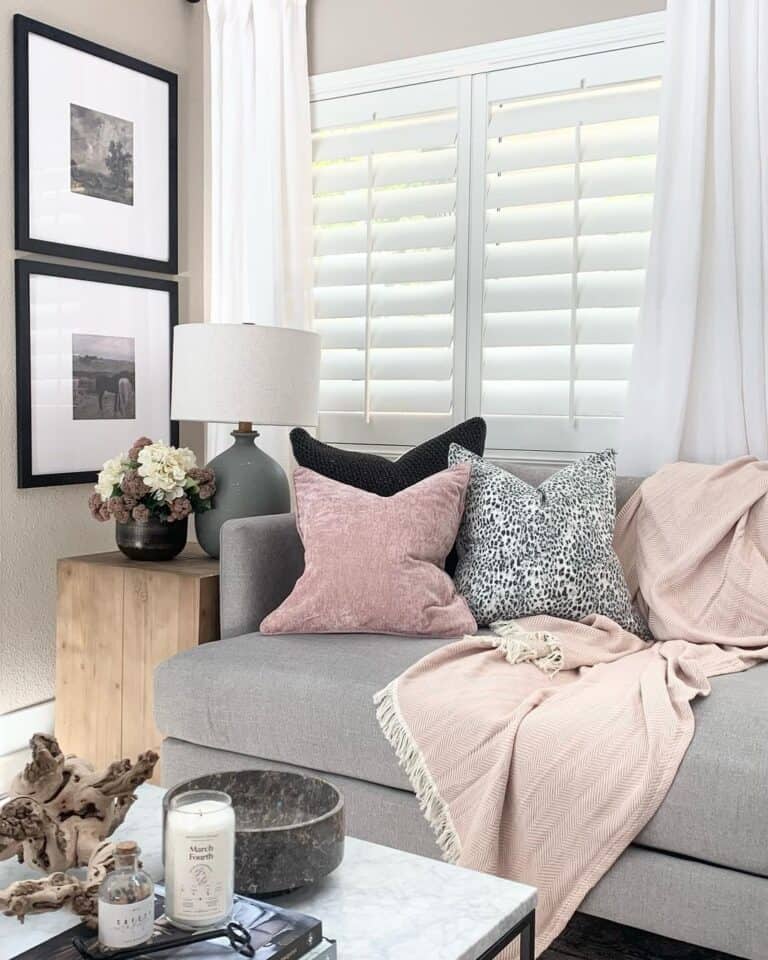 Pink and Black Pillows on Gray Sofa
