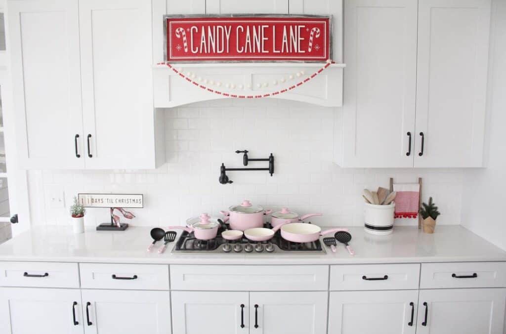 Pink and Red Accents in White Kitchen