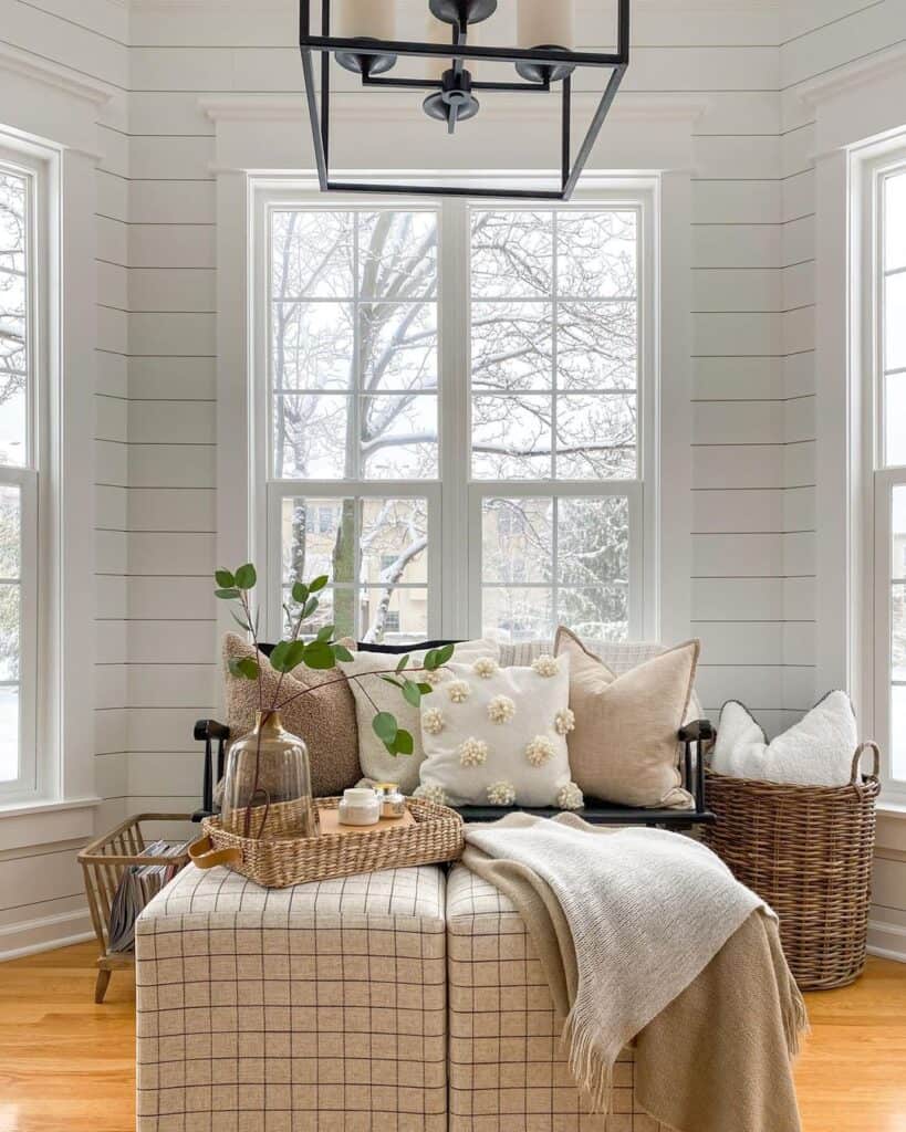 Plaid Ottomans with Brown and White Blankets And Woven Tray