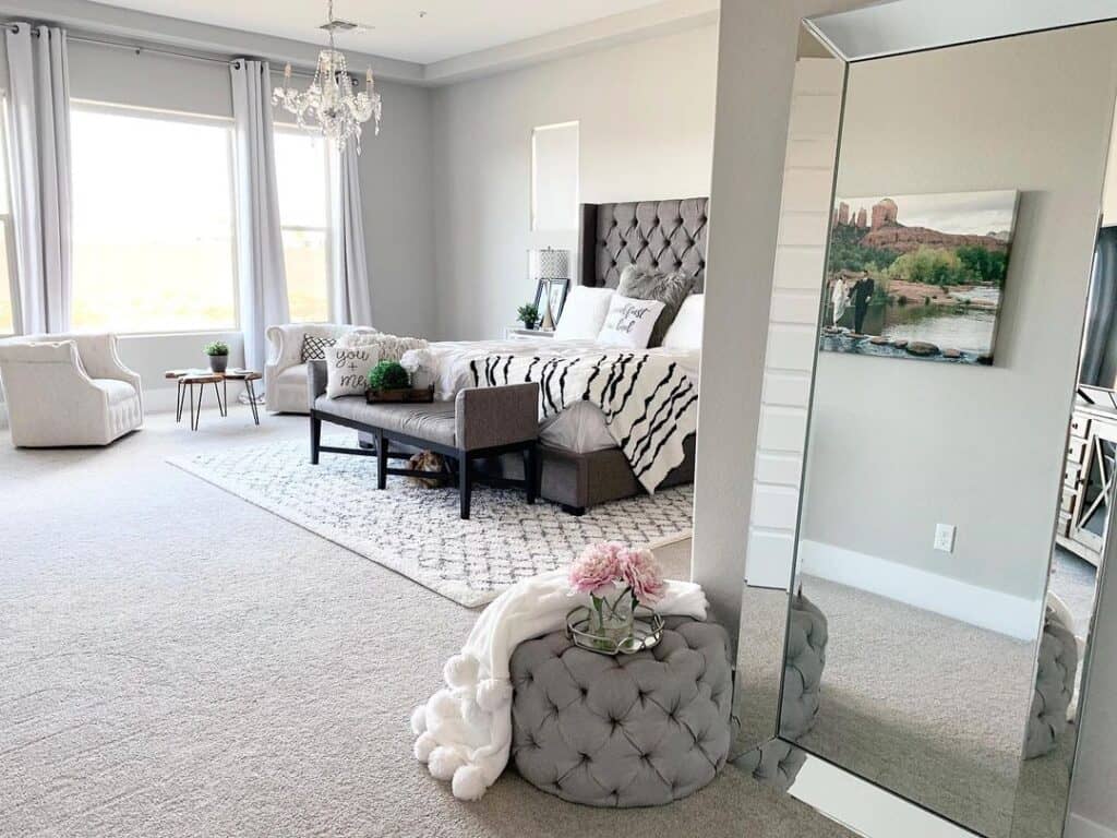 Primary Bedroom with Tufted Ottoman and Matching Headboard