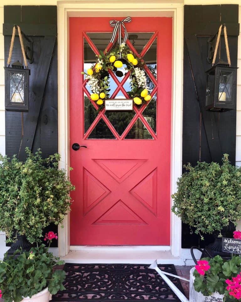 Red Farmhouse Door and Black Lanterns