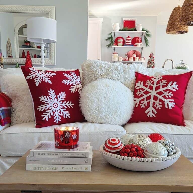 Red and White Christmas Throw Pillows on White Sofa