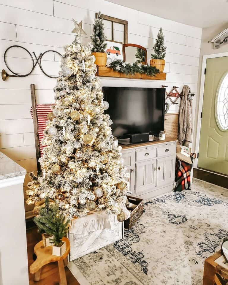 Silver and Gold Christmas Tree Decorations Near a Rustic Ladder