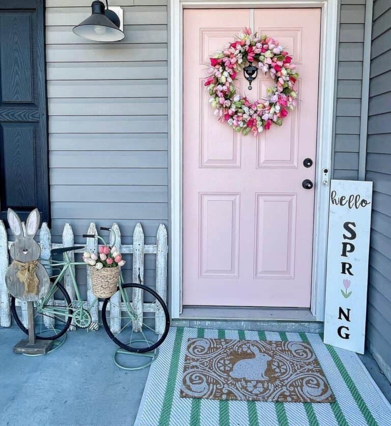 Spring Themed Porch With Pink Front Door
