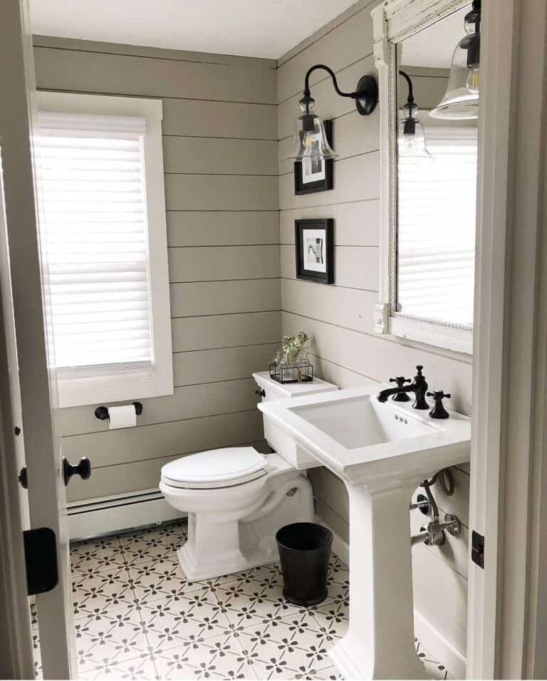 Square Pedestal Sink Bathroom with Patterned Tile Floor