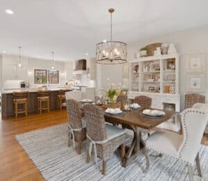 Stained Wood Dining Table with Rattan Chairs