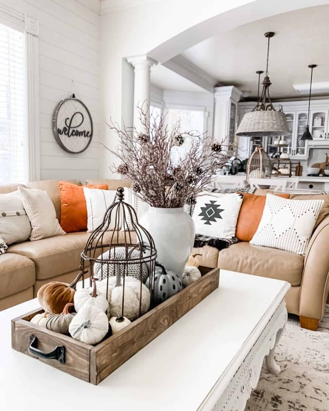 Tan Sectional with White and Orange Leather Throw Pillows Soul