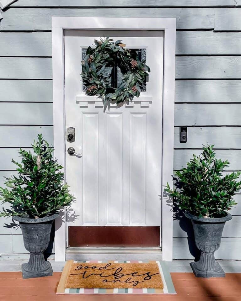 Topiaries by a White Front Door