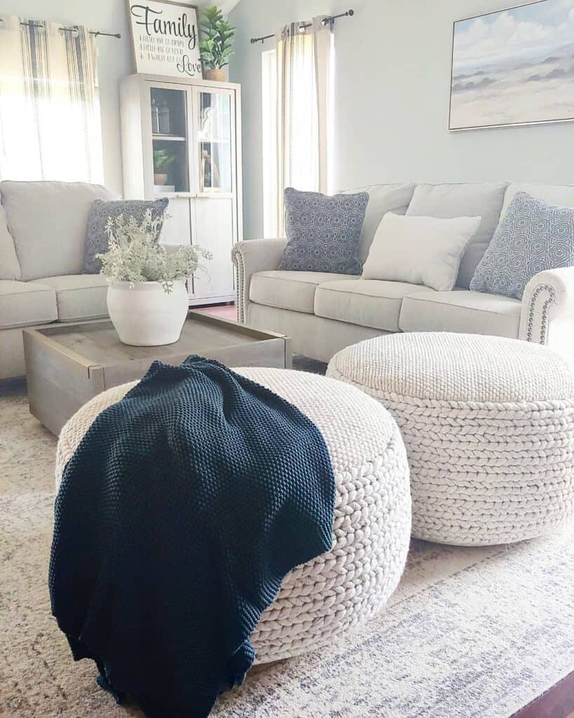 Two White Knit Poufs with Black Blanket