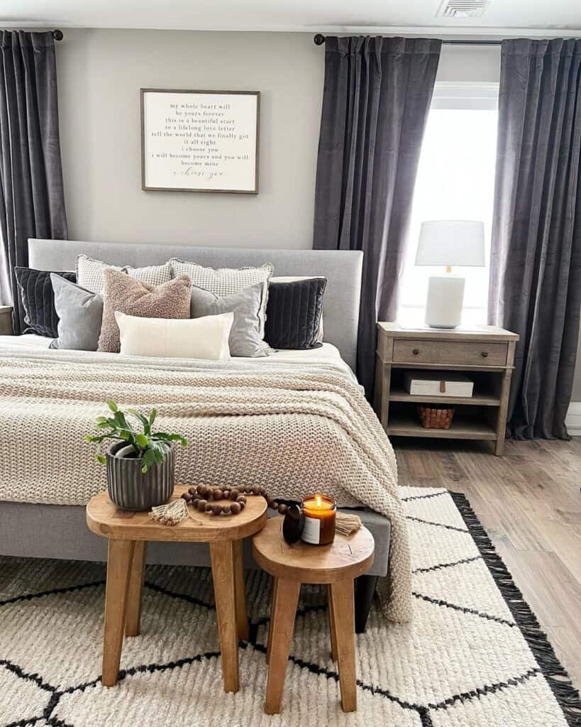 Two Wood Stools Beside Gray Bedframe