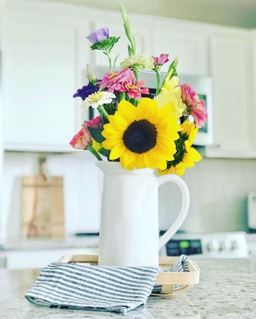 Vibrant Flowers in White Kitchen Jug