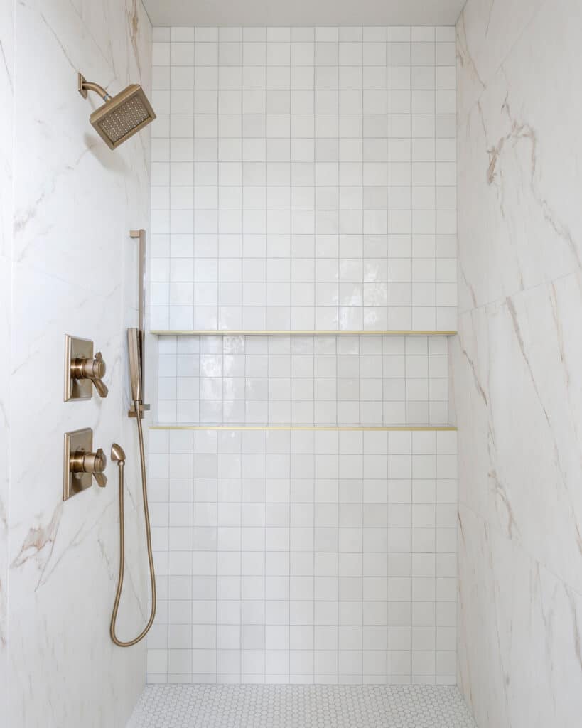 When One Isn't Enough: a Brass Rain Shower Head and a Brass Shower Head With a Hose