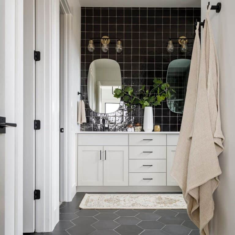 White Bathroom With Black Bathroom Floor Tile and Black Backsplash