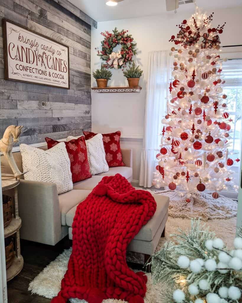 White Christmas Tree with Red Ornaments and Warm White Lights