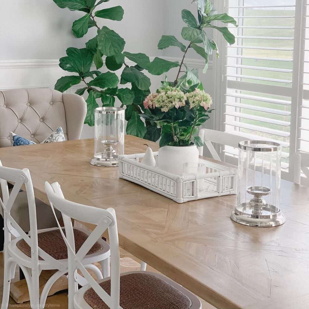 White Dining Chairs Around a Wood Dining Room Table