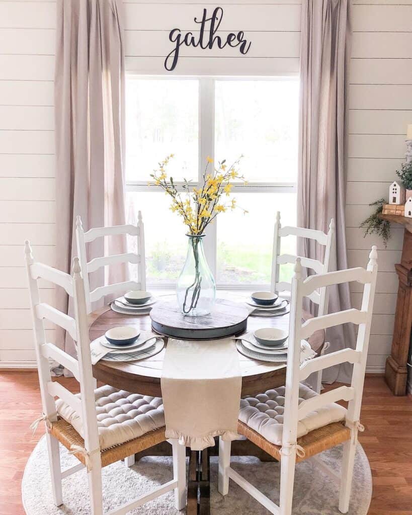 White Dining Chairs and White Shiplap Dining Room Walls