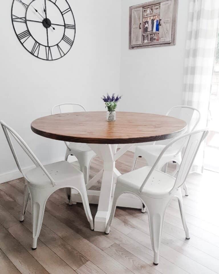 White Dining Room Chairs and Purple Flowers in a Glass Jar